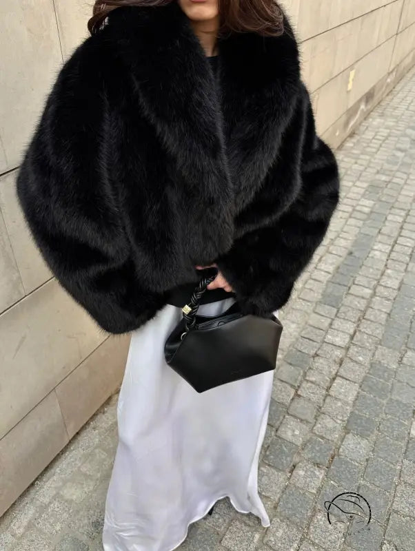 Cozy short faux fur coat with black fur, high collar, and long sleeves