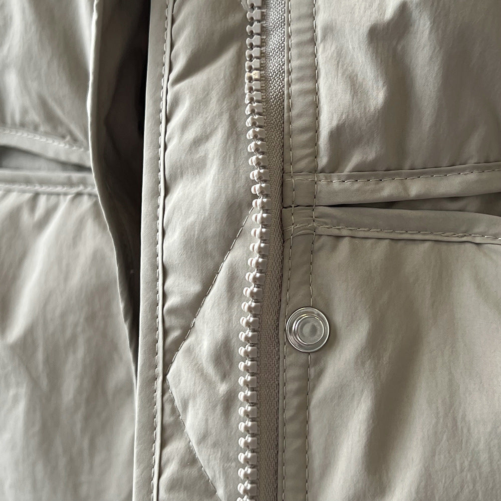 White plastic zipper with stitching on a light jacket from Langry fashion ملابس