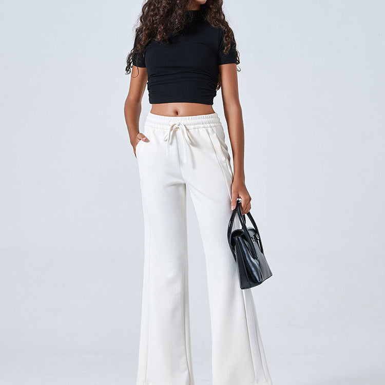 White wide-leg drawstring pants with a black crop top for stylish summer fashion ملابس