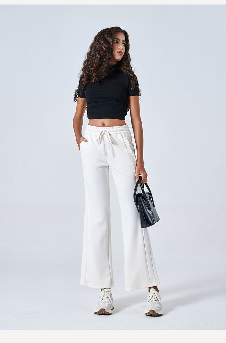 White wide-leg drawstring pants with a black crop top for stylish summer fashion ملابس