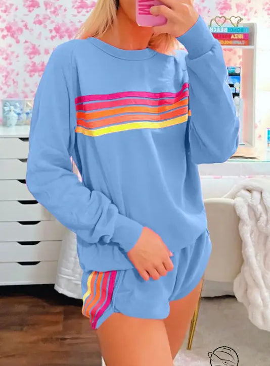 Light blue loose slim fit sweatshirt with rainbow stripes on chest