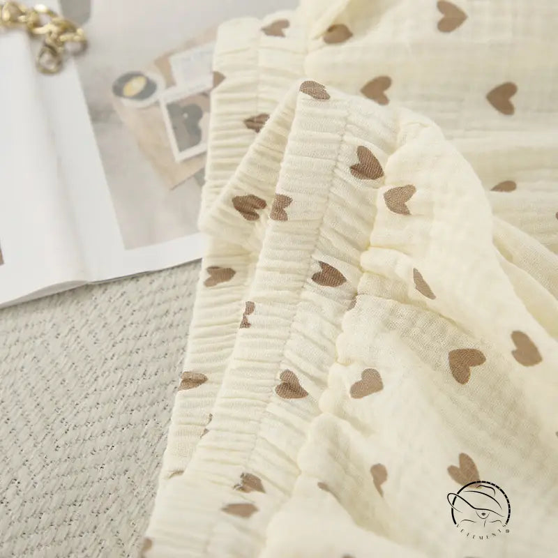 Cream-colored cotton linen homewear with heart patterns and slit shorts