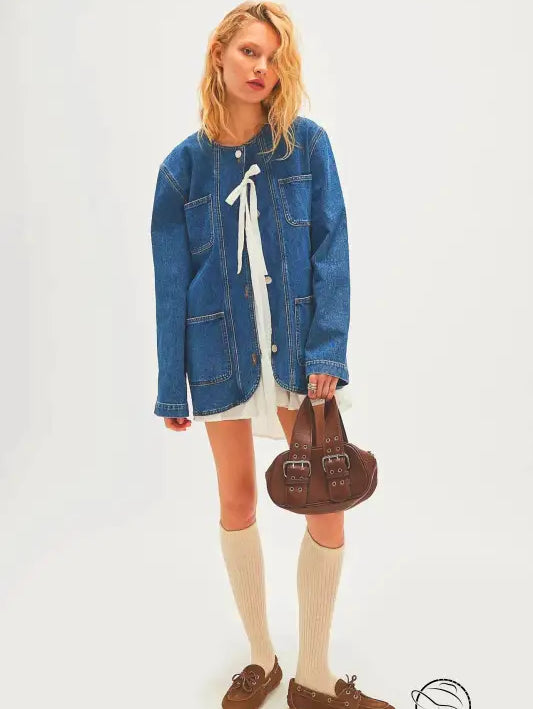 Woman in casual fashionable cowboy coat with white dress, socks, loafers, bag