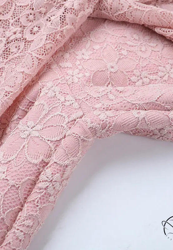 Elegant dusty rose lace jumpsuit with floral pattern for bridal fashion