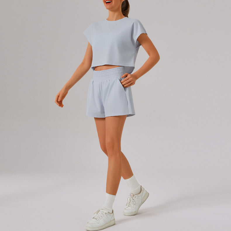 Light blue Loose Sports Yoga Fitness Set with white sneakers, perfect for stylish workouts