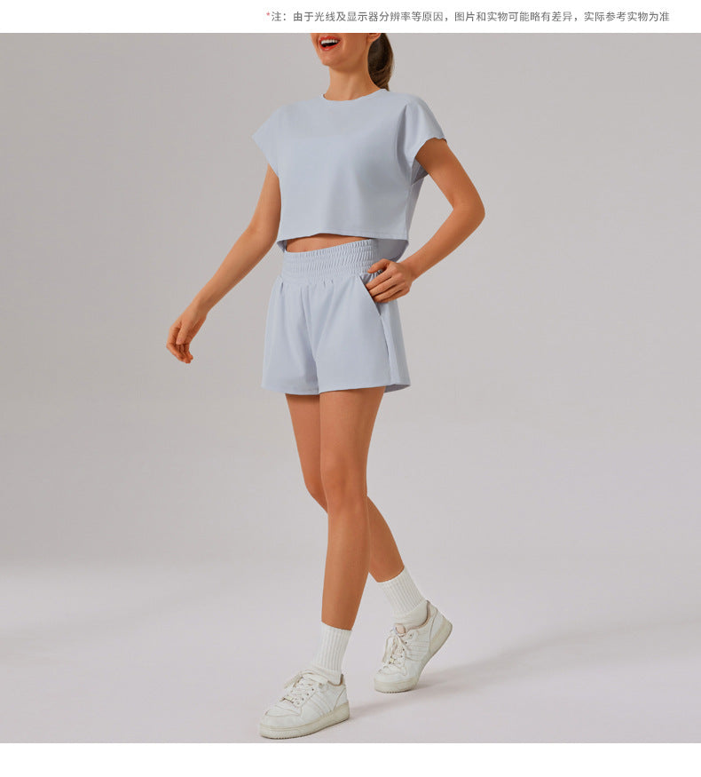 Light blue Loose Sports Yoga Fitness Set with white sneakers, perfect for stylish workouts