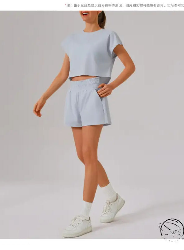 Light blue loose sports yoga fitness set with white sneakers