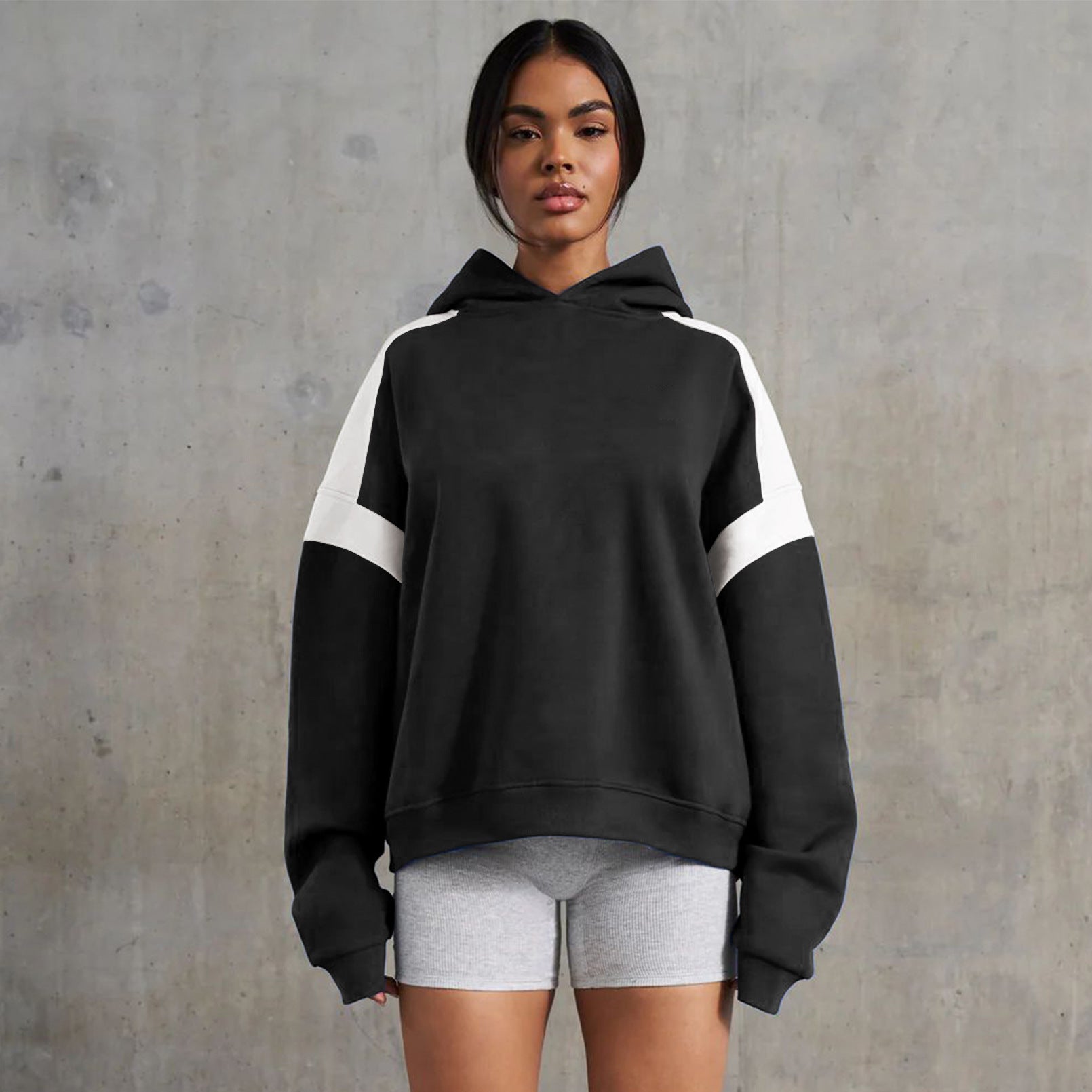 Black and white color-blocked hoodie from Langry, a stylish high-end fashion sweater