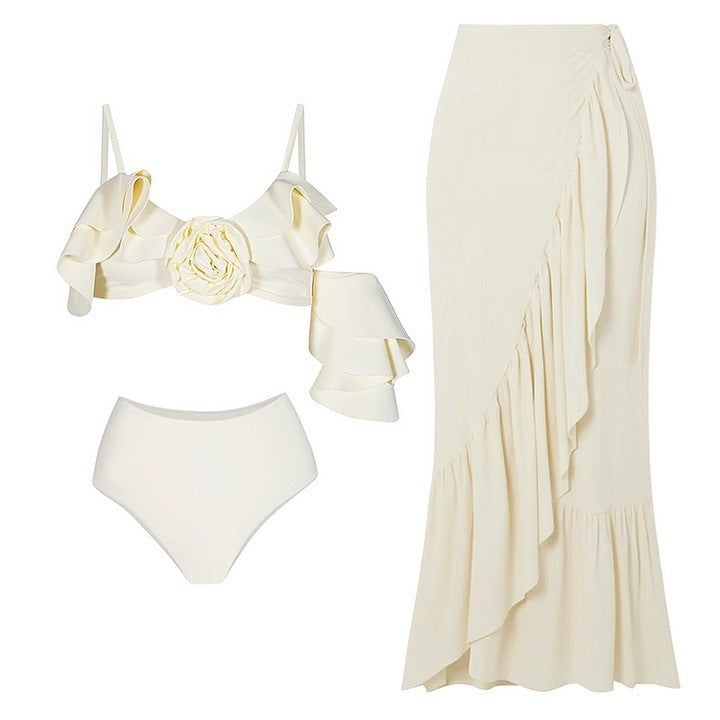 Ivory-colored ruffled swimsuit and skirt, an elegant retro swimsuit for stylish beach days