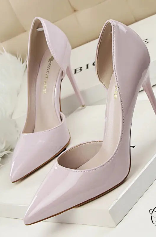 Pale pink patent leather low cut high heels with pointed toes