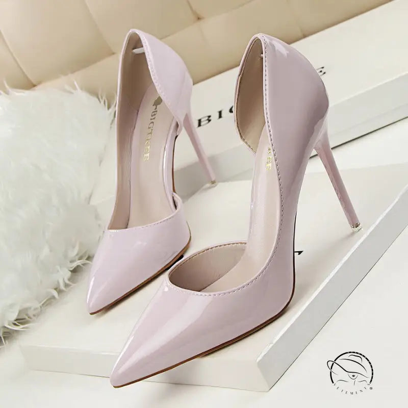 Pale pink patent leather low cut high heels with pointed toes