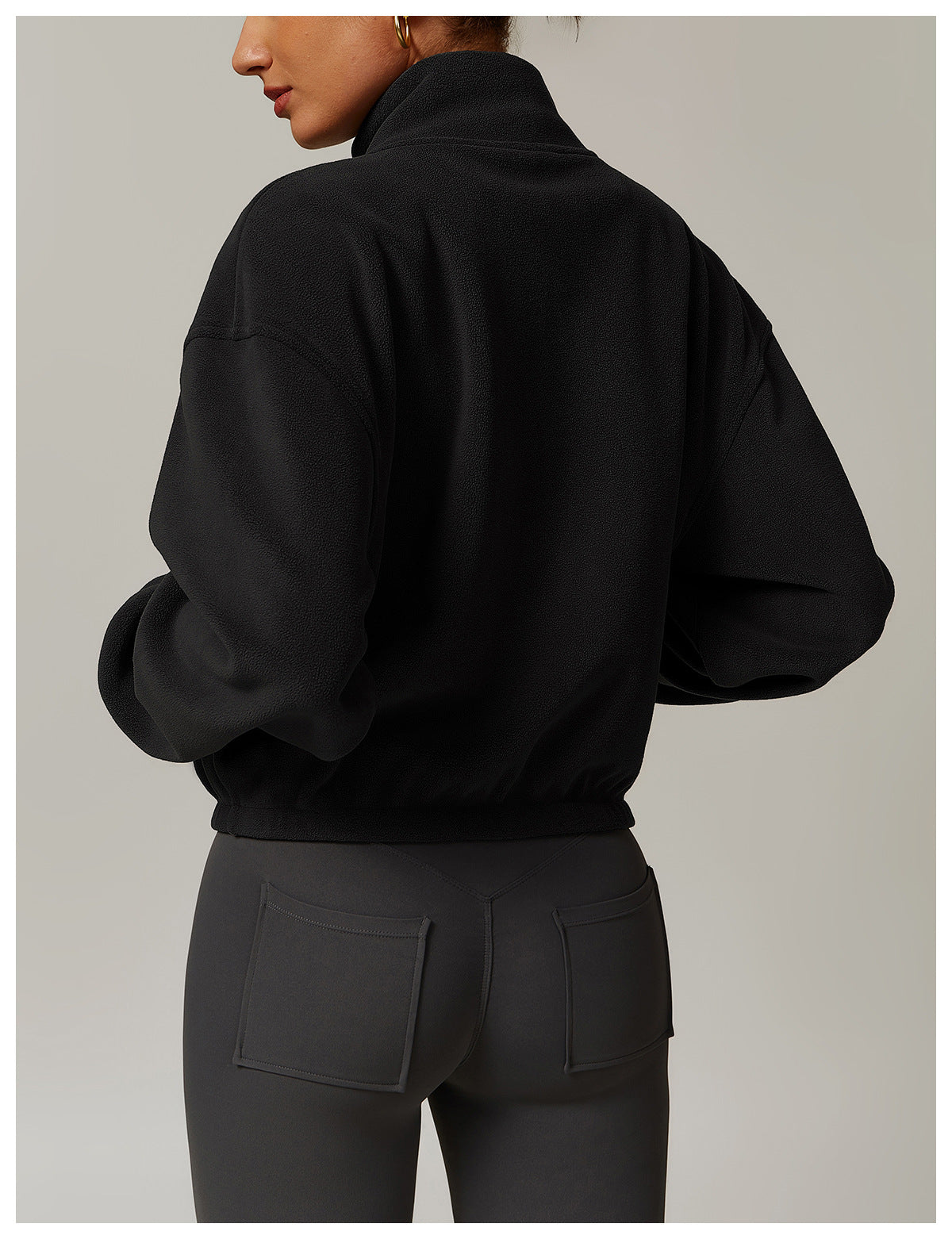 Black cropped zip-up sweatshirt with high collar, a stylish choice in ملابس fashion