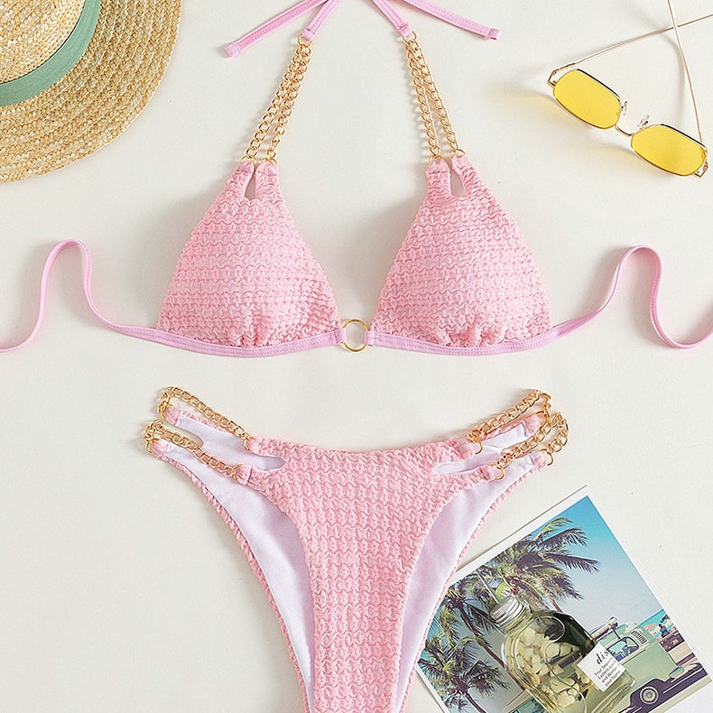 Pink textured bikini with gold chain accents from the Backless Split Swimsuit collection