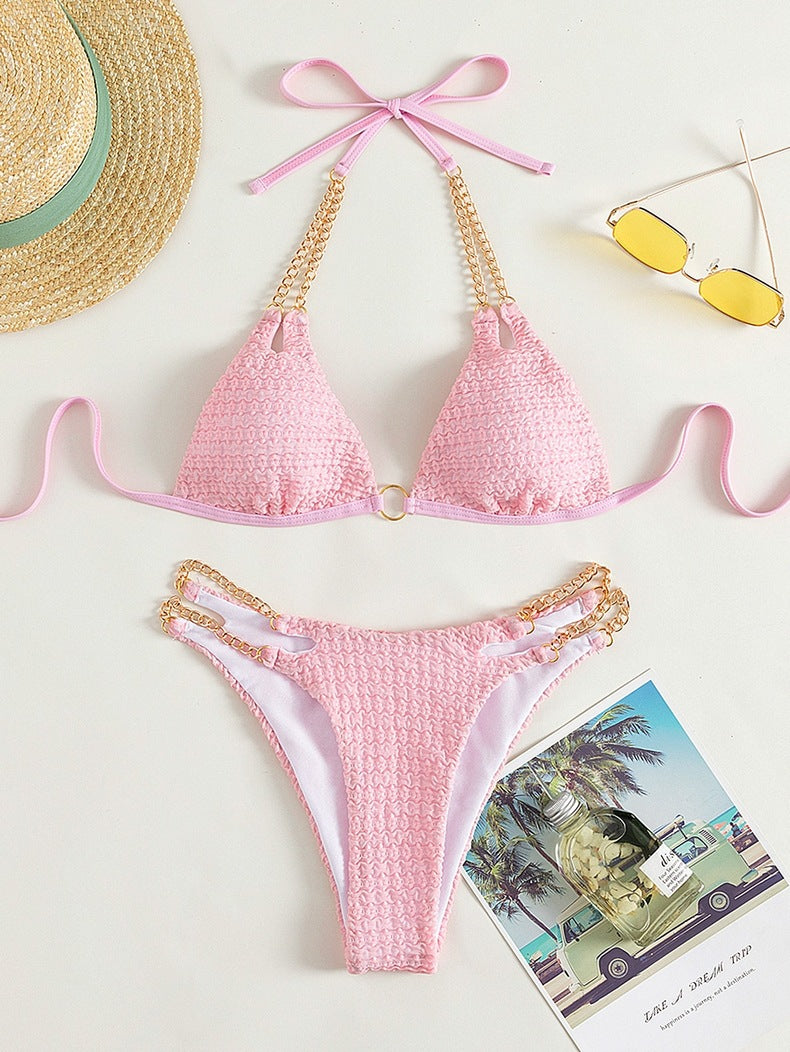 Pink textured bikini with gold chain accents from the Backless Split Swimsuit collection