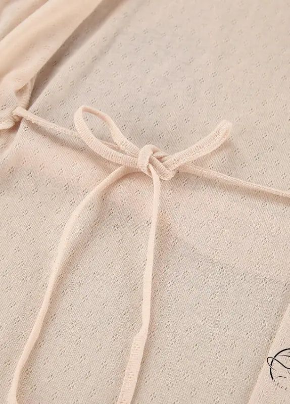 Delicate beige lace langry fashion dress with dotted pattern and bow neckline