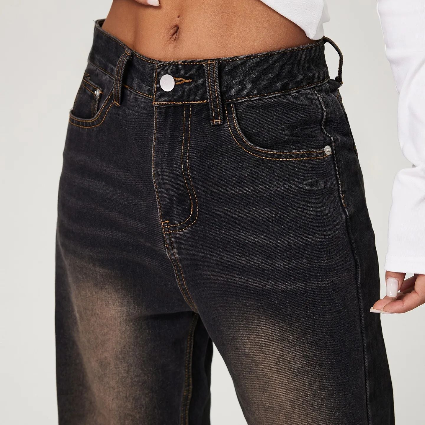 Dark wash high-waisted denim jeans with faded detailing for stylish fashion ملابس