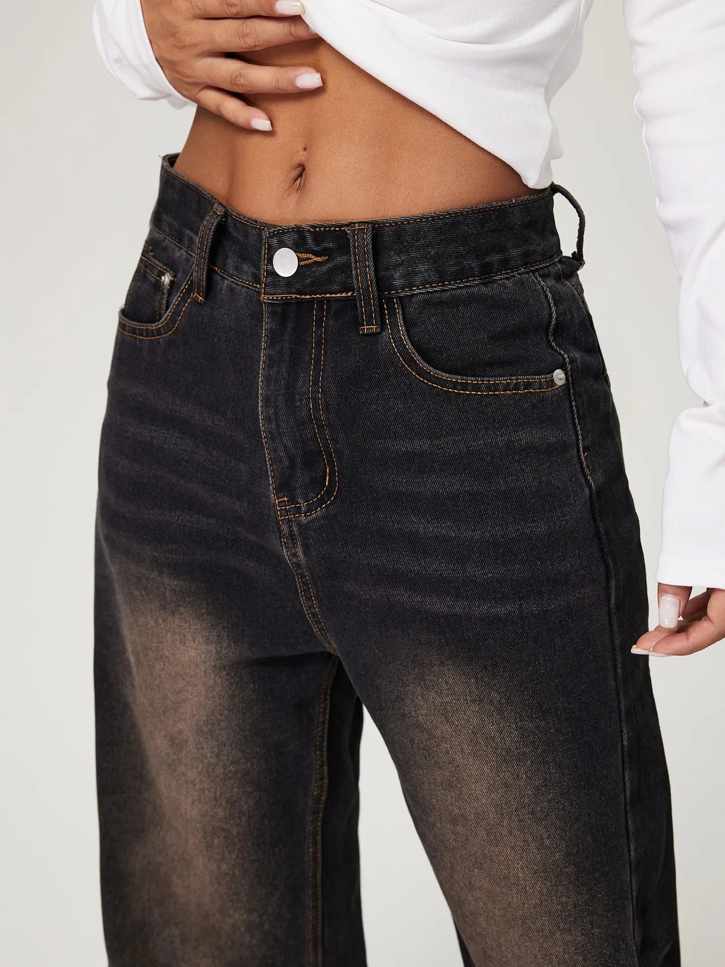 Dark wash high-waisted denim jeans with faded detailing for stylish fashion ملابس