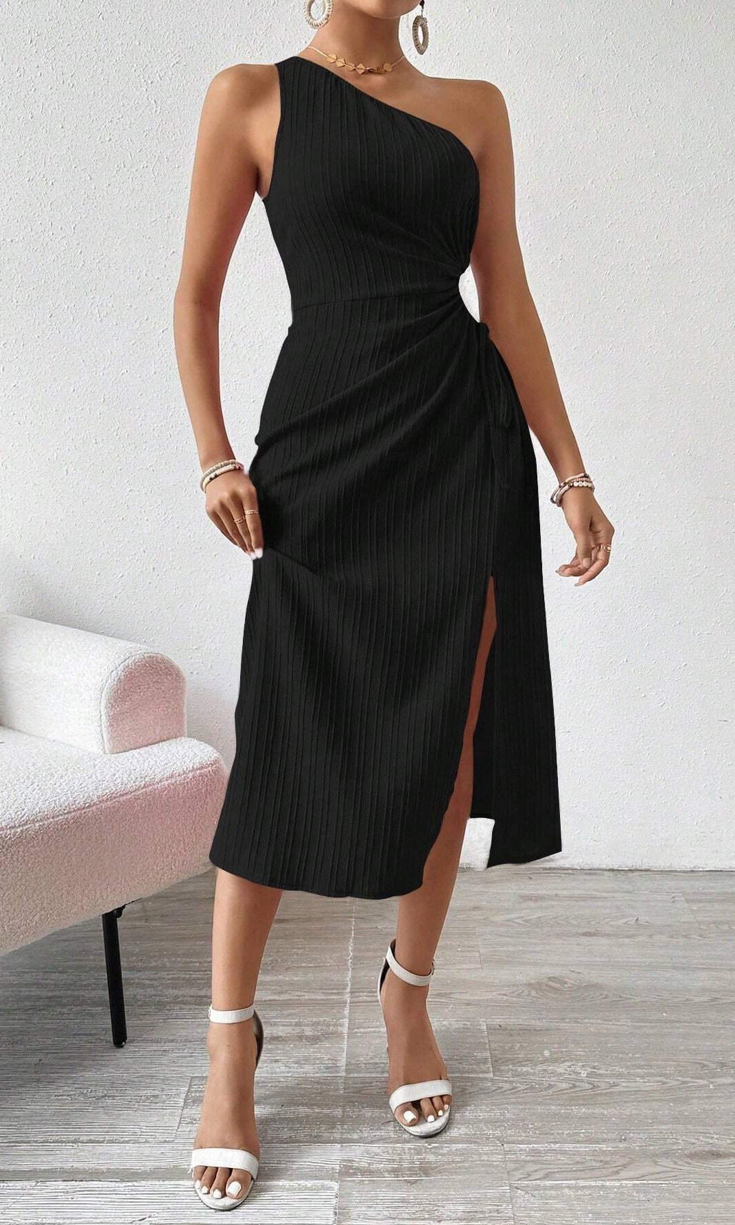 Black one-shoulder midi dress with side slit showcasing elegant fashion and style