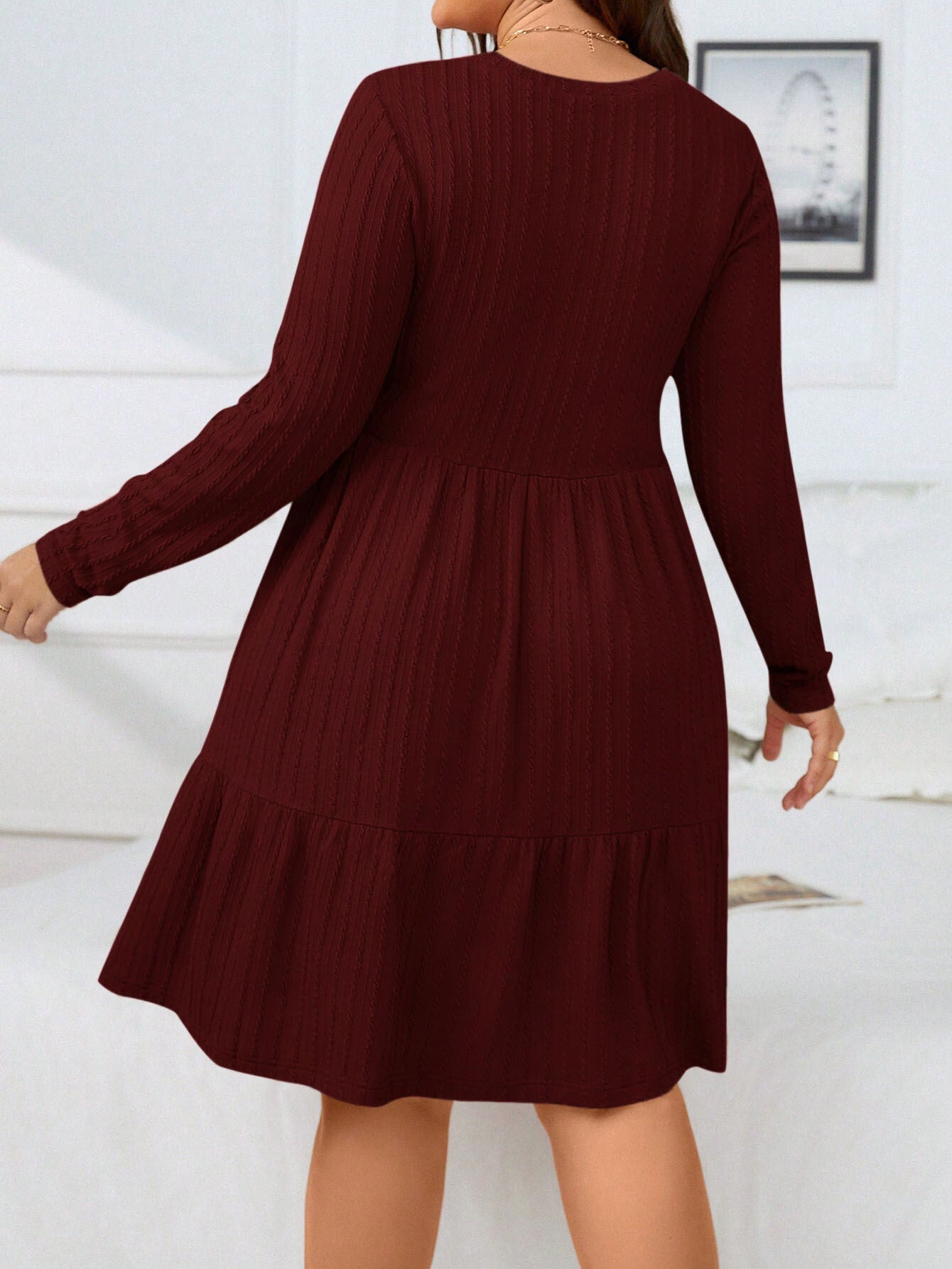 Elegant red midi dress with long sleeves and tiered design, perfect for formal occasions