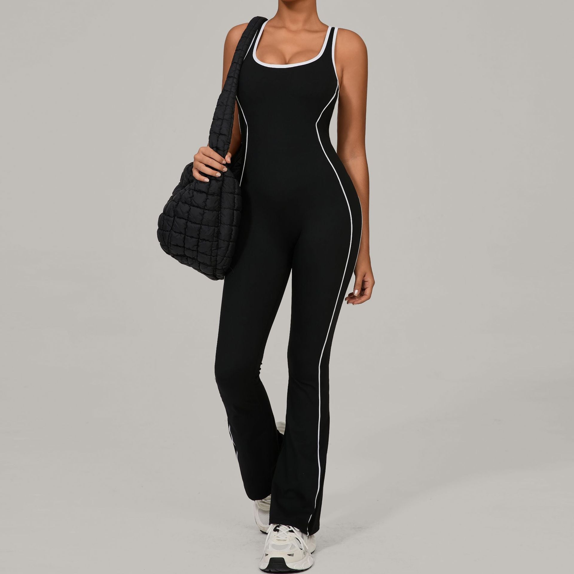 Black and white Lululemon Beauty Back Yoga Jumpsuit with contrast piping