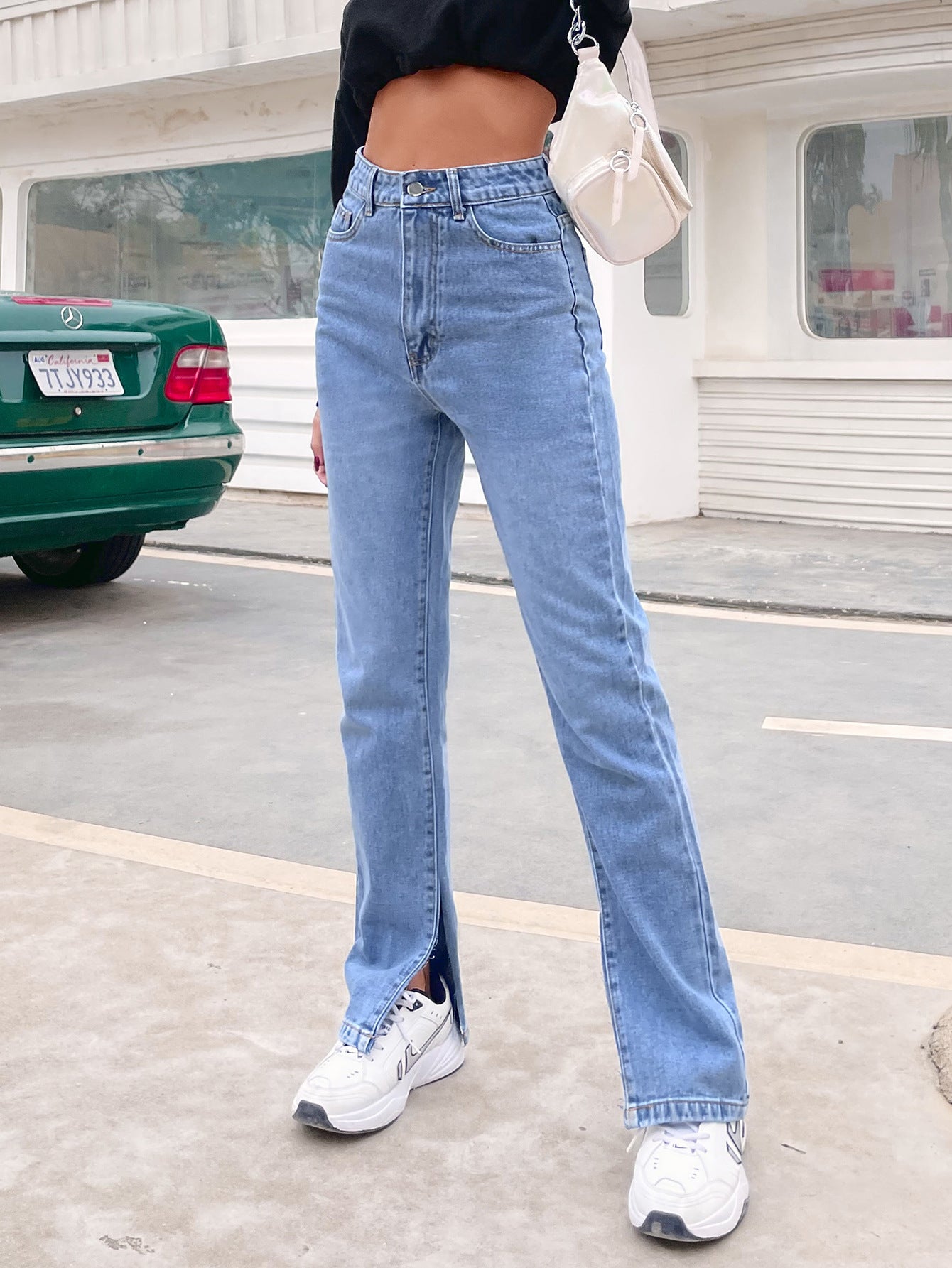 Light blue high-waisted denim pants with split flared hems, stylish Langry fashion choice