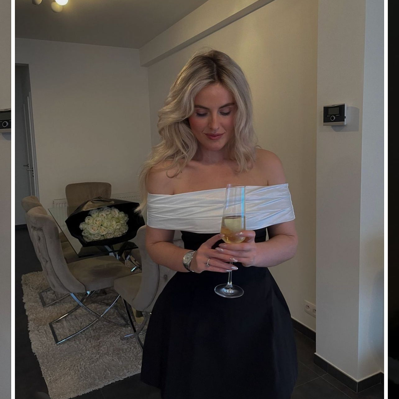 Elegant woman in black white swing bow dress holding champagne, fashion stylish ملابس