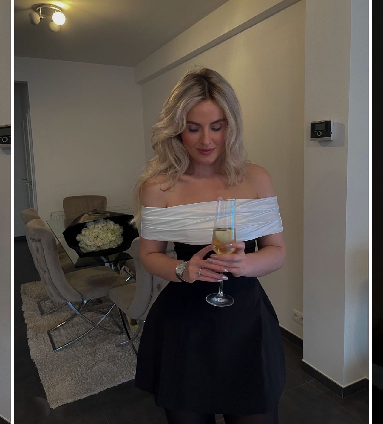 Elegant woman in black white swing bow dress holding champagne, fashion stylish ملابس