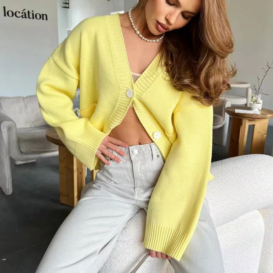 Knitted cardigan sweater coat in yellow with pearl buttons and wide sleeves