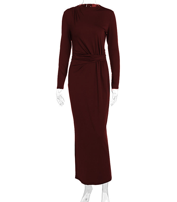 Sleek burgundy long-sleeved maxi dress with fitted waist tie