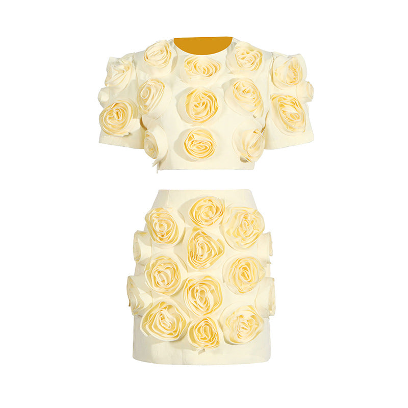 Two-piece cream outfit with fabric roses, featuring a puff sleeve top and high waist skirt