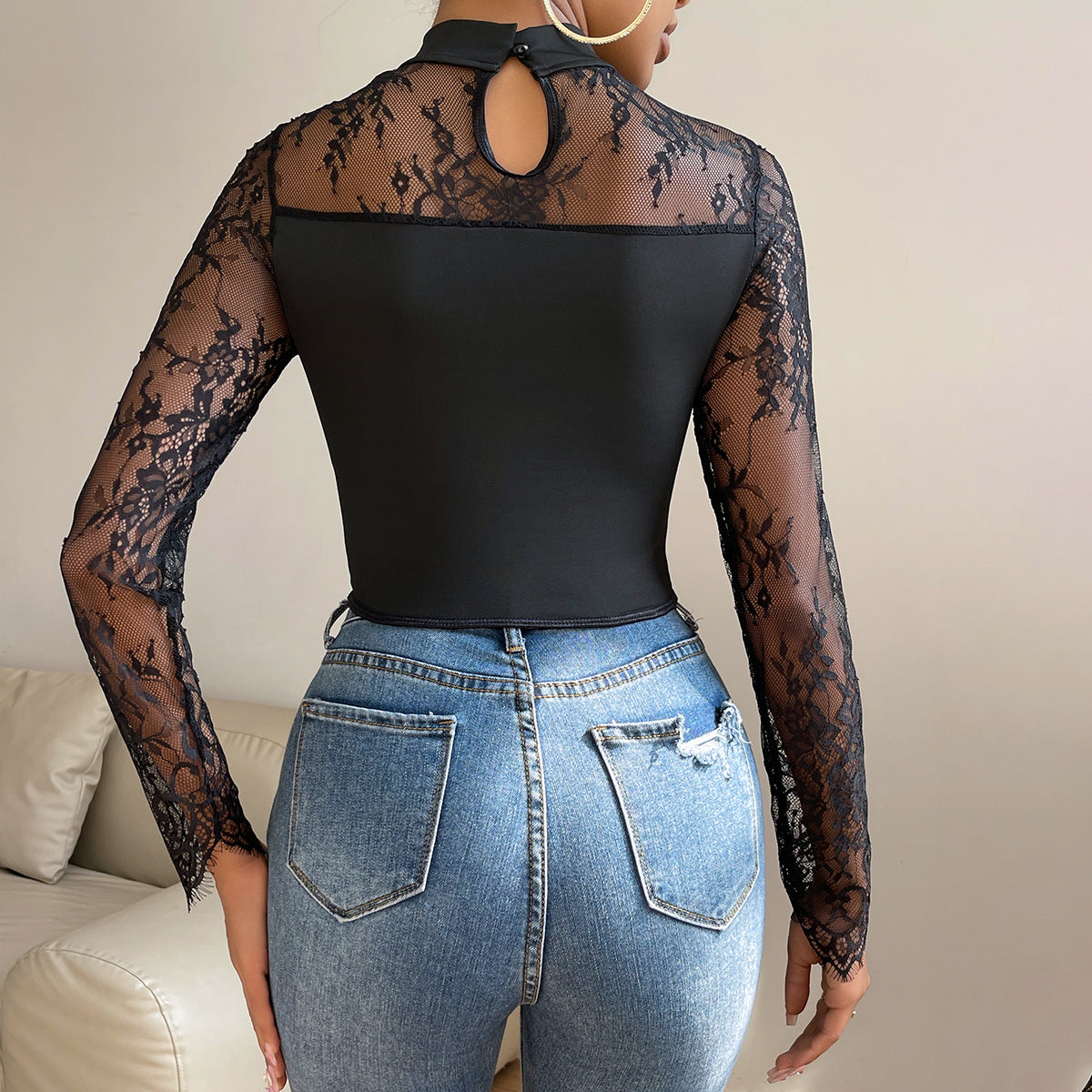 Elegant black mock neck top with lace long sleeves and back, perfect for fashion