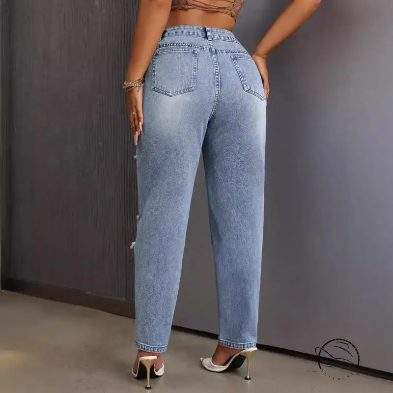 Slimming skinny ripped jeans in light wash distressed denim with side pearl embellishments