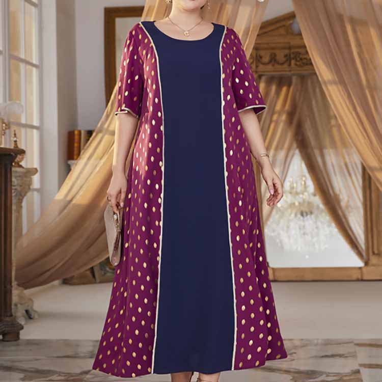 Woman in a comfy high waist elastic dress with dark blue and maroon polka dot panels