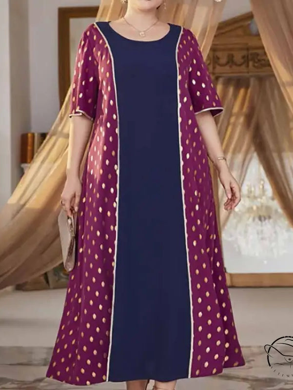 Woman in comfy high waist elastic dress with blue center, maroon gold polka dots