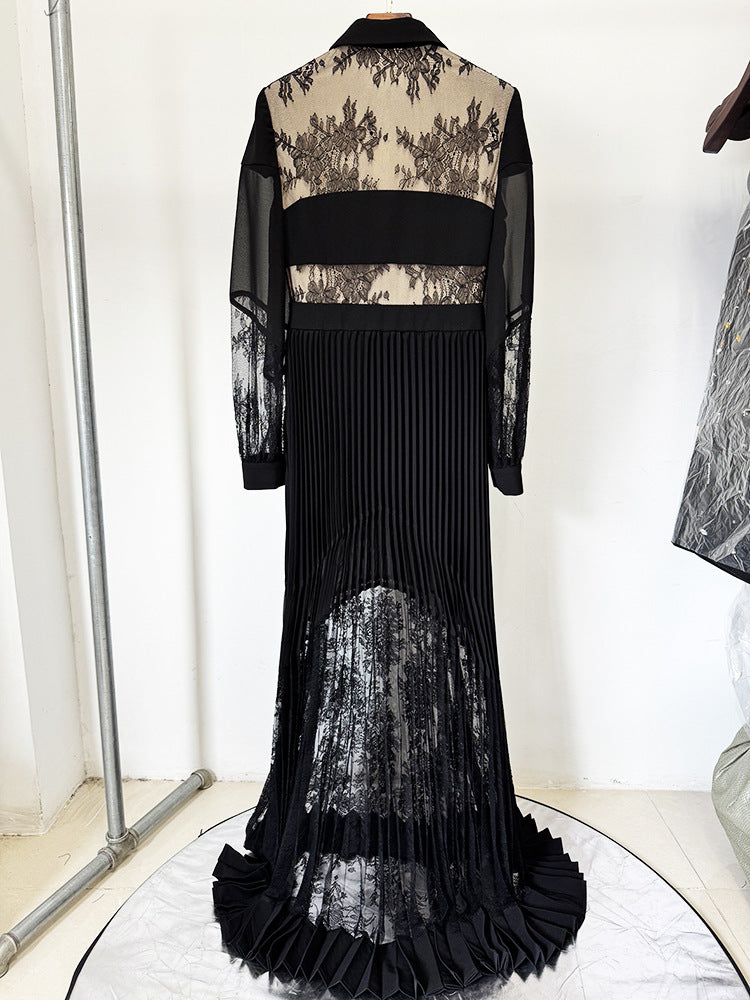 Elegant long black pleated dress with lace accents showcasing luxury fashion style