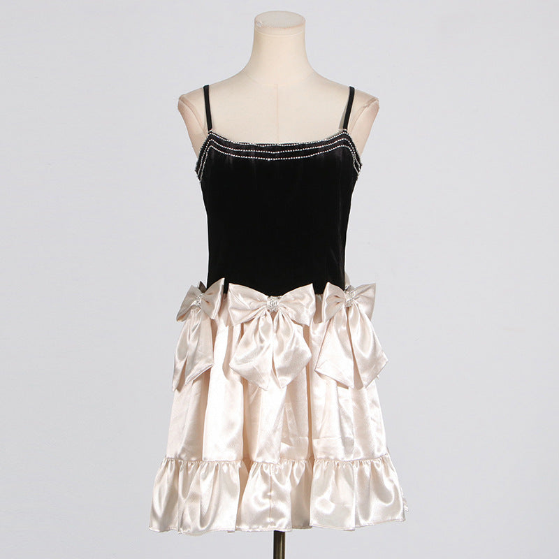 Black velvet and cream satin party dress with rhinestone trim, ideal for elegant fashion ملابس