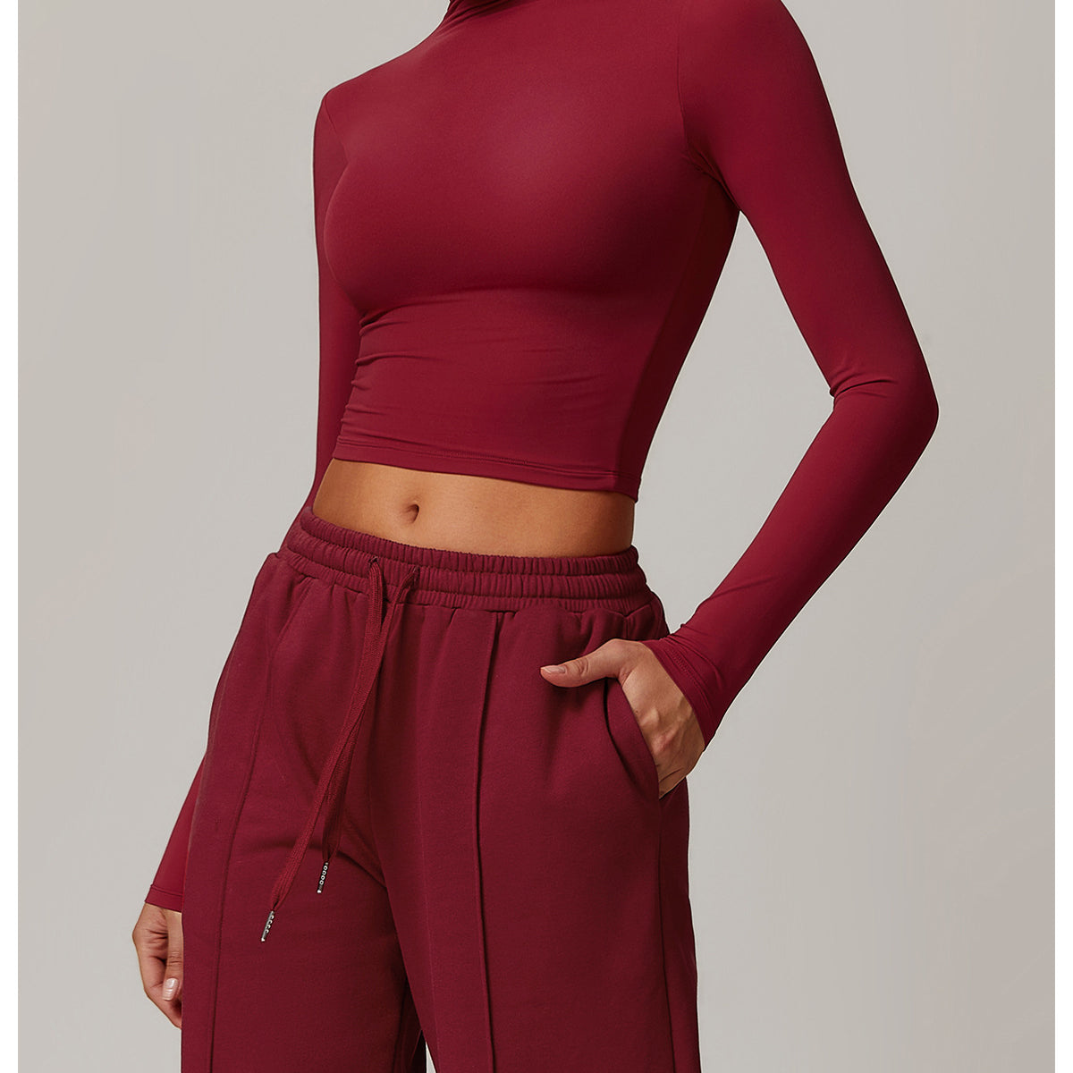 Burgundy long-sleeved crop top with mock neckline for quick drying fitness sports outerwear