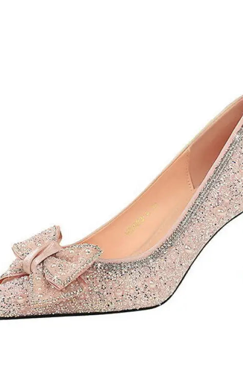 Elegant rose gold glitter Kate Spade stiletto pumps with bowknot rhinestone detail