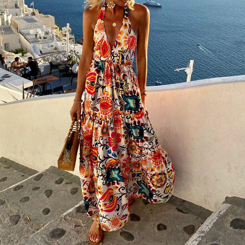 Woman wearing a vibrant summer halter backless holiday dress with floral print