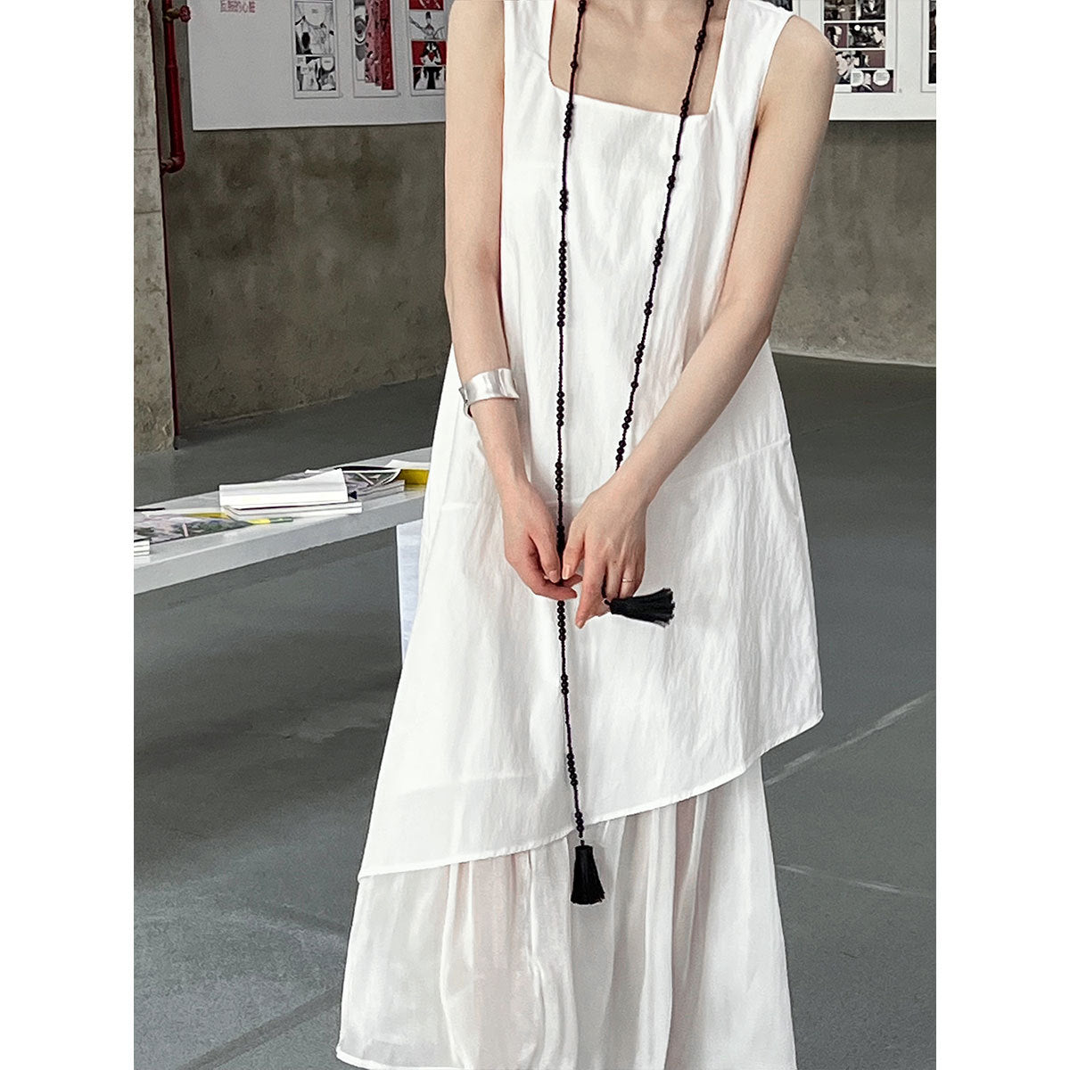 White layered sleeveless dress with black tassel cord details in Elegant Korean Style