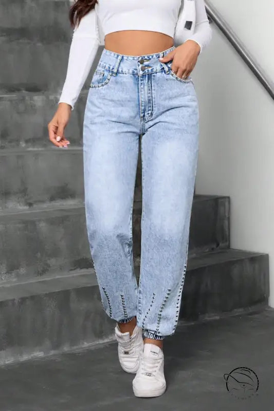 Light wash high-waisted beaded straight jeans with elastic cuffs