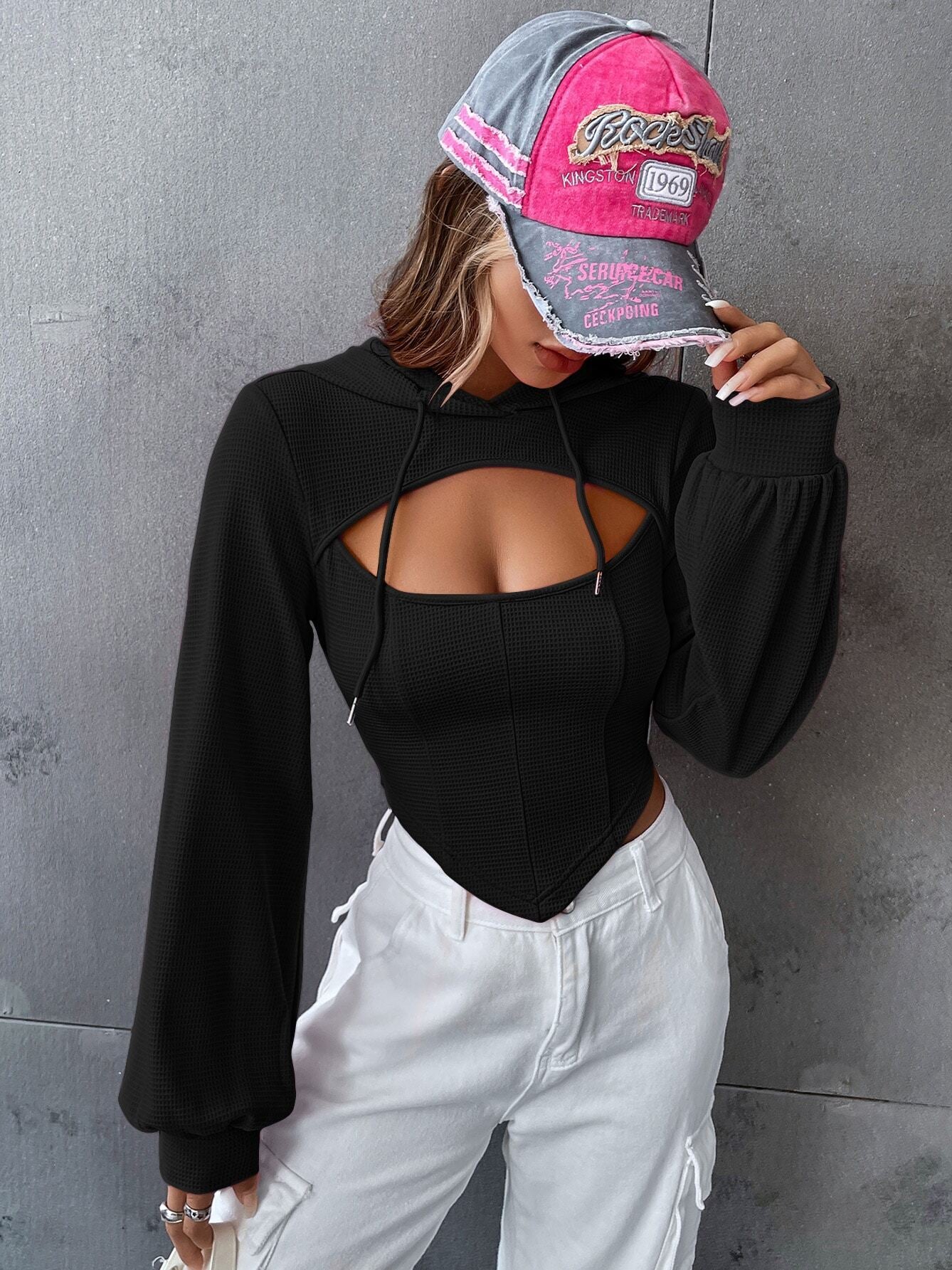 Fashionable Slim Short Faux Two Piece Top worn by woman with pink and gray baseball cap