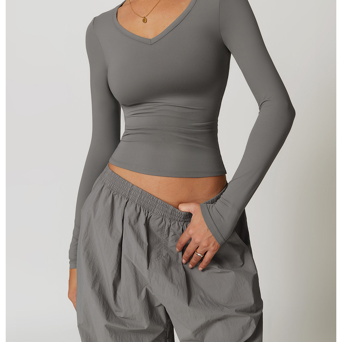 Gray long-sleeved V-neck top and baggy pants from Winter Quick Drying Brushed Tight Yoga T shirt for stylish langry fashion and ملابس