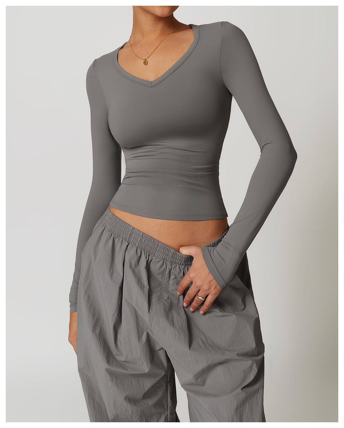 Gray long-sleeved V-neck top and baggy pants from Winter Quick Drying Brushed Tight Yoga T shirt for stylish langry fashion and ملابس