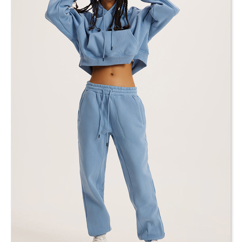 Light blue cropped hoodie and sweatpants loungewear set for stylish winter fashion ملابس