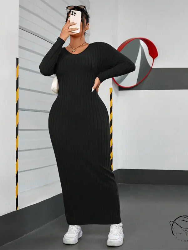 Black ribbed maxi dress in winter minimalist slim fit sheath style
