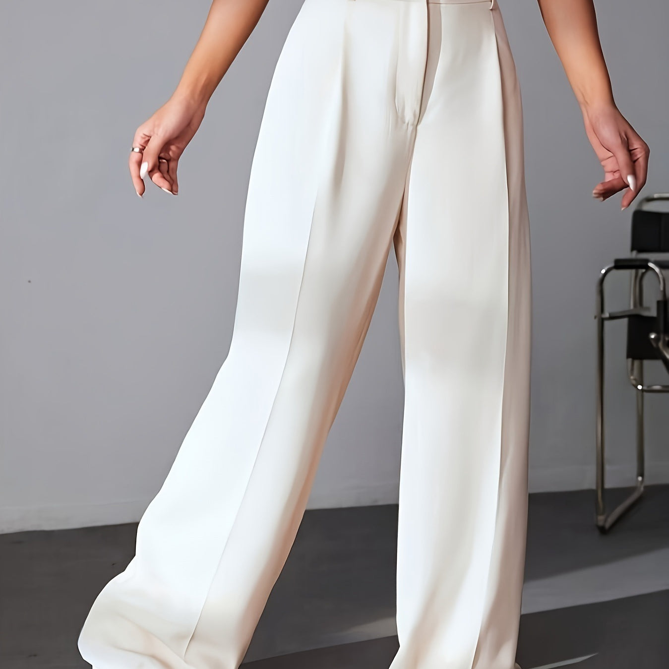Cream-colored wide leg dress pants with pleats, ideal for stylish work fashion