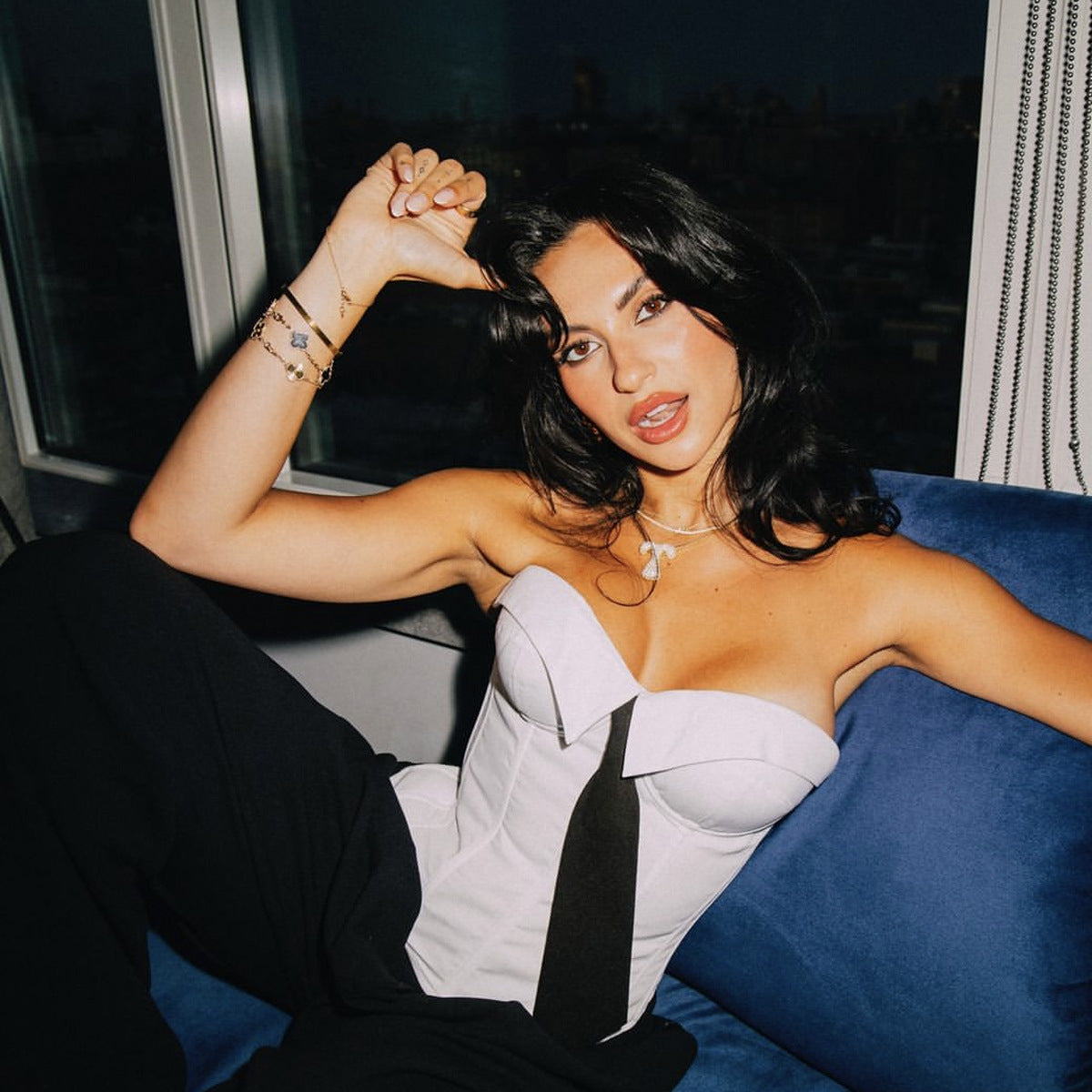 Elegant comfy corset featuring a woman in a white corset top showcasing fashionable ملابس