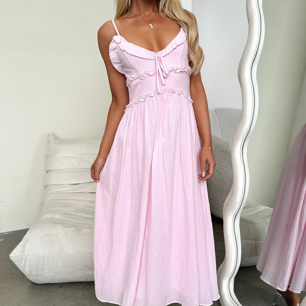 Light pink midi sundress with spaghetti straps, perfect for elegant summer fashion