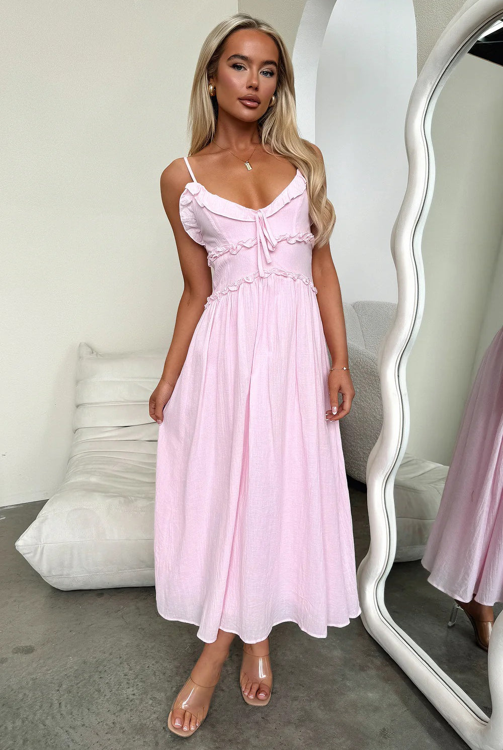 Light pink midi sundress with spaghetti straps, perfect for elegant summer fashion